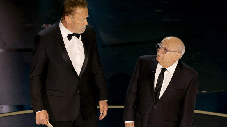 Danny DeVito and Arnold Schwarzenegger presenting