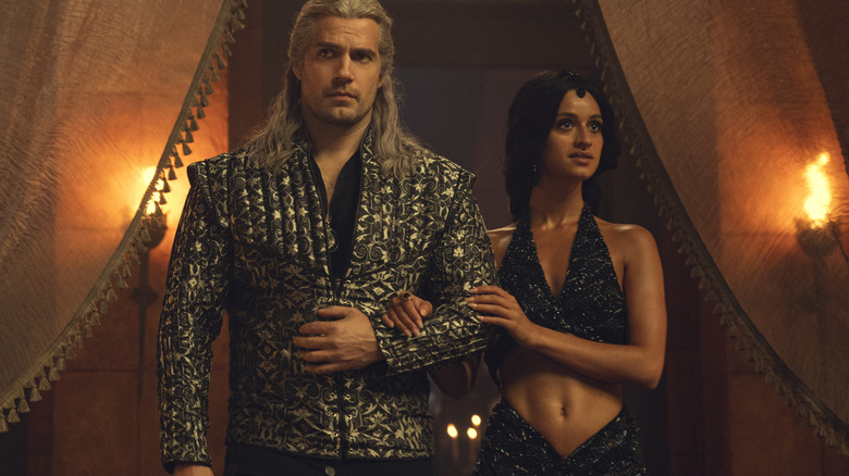 Geralt stands with Yennefer