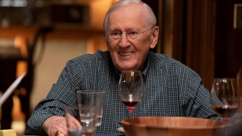 Henry Reagan smiles at the dinner table