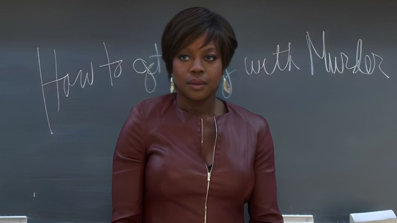 Annalise Keating stands in a classroom