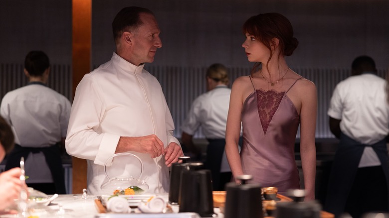 Chef Slowik and Margot looking at each other