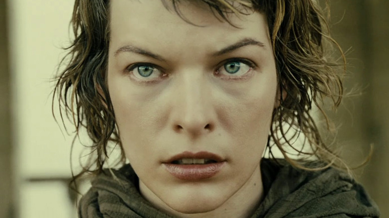 Milla Jovovich looking concerned in Resident Evil