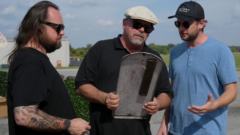 Rick Harrison looking at an item