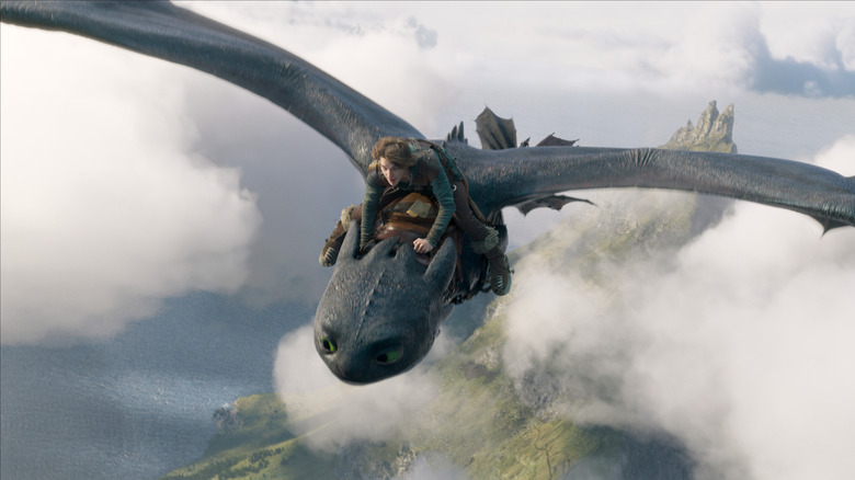 Hiccup on Toothless' back as they fly in clouds (2025)