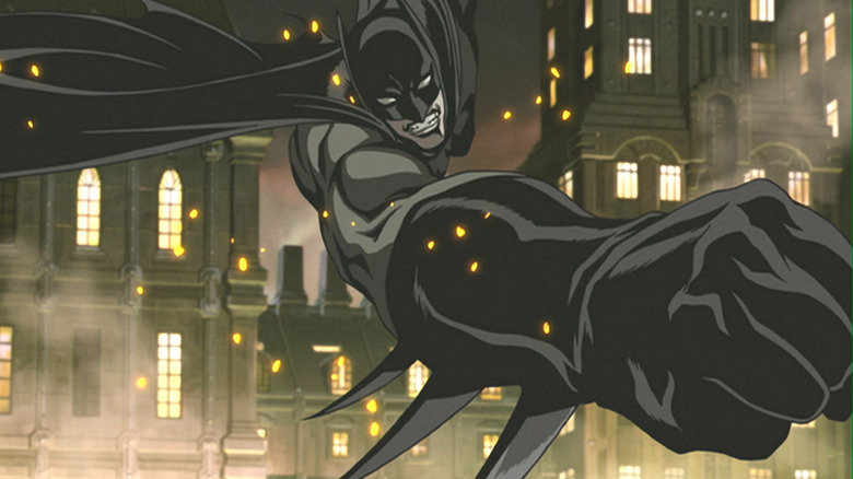 Batman swings through the city in Batman: Gotham Knight