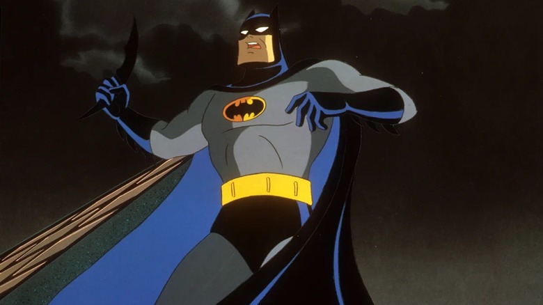 Batman prepares to throw a batarang in Batman: Mask of the Phantasm