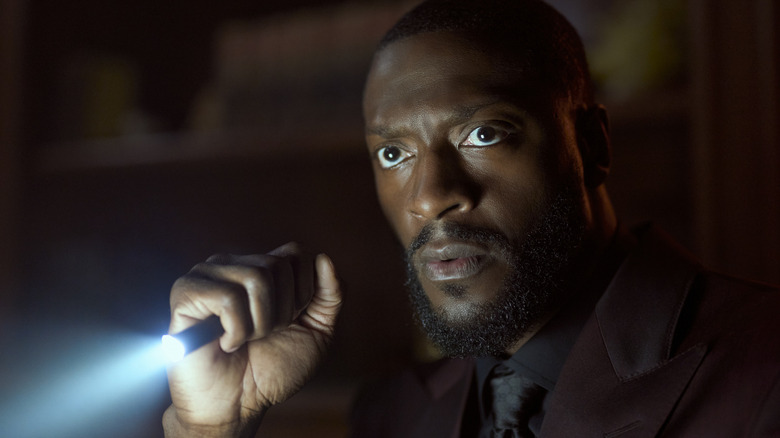 Alex Cross brandishes a flashlight in "Cross"