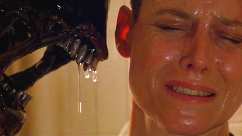 Ripley winces as the xenomorph looms over her in Alien 3 (1992)