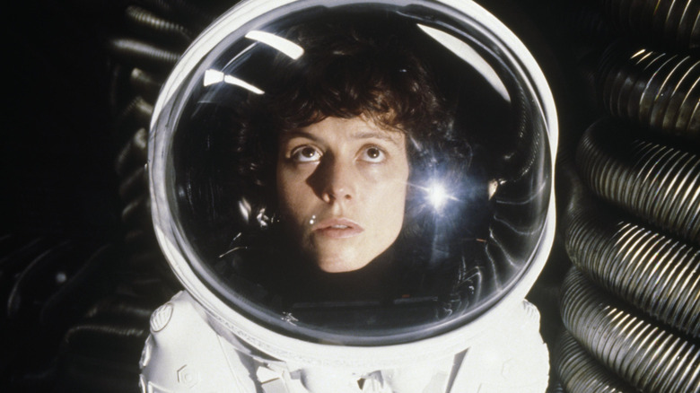 Ripley wearing spacesuit looking up in Alien (1979)
