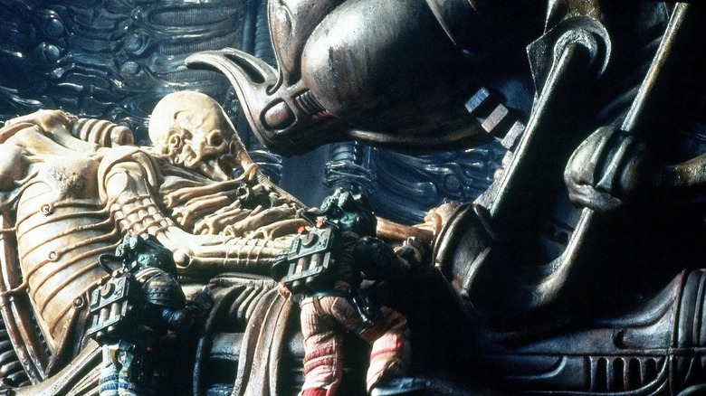 Nostromo crew inspect the calcified Engineer in Alien