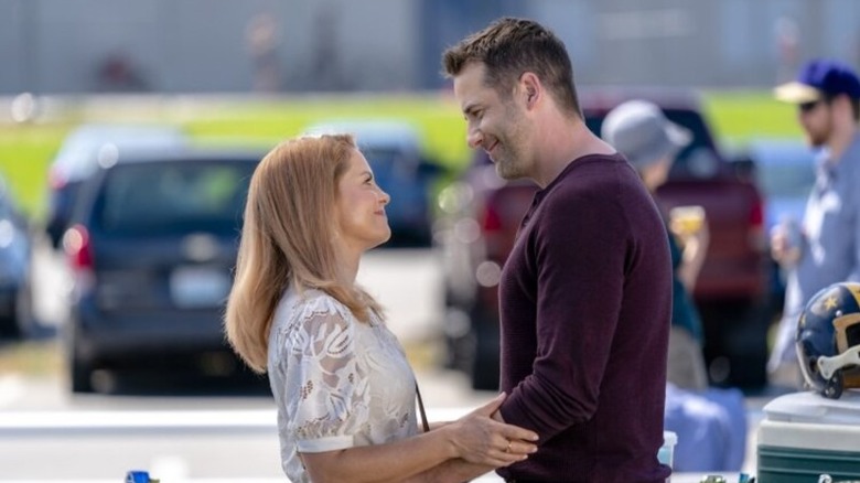 Aurora and Nick embracing in "Reunited and It Feels So Deadly"