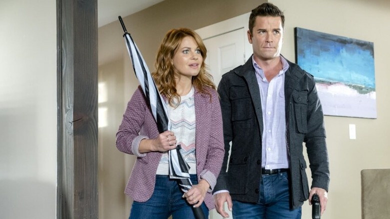 Aurora and Martin standing in a hallway in "The Julius House"