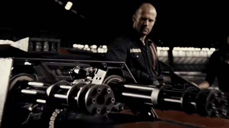 Frankenstein looking at car with gattling guns in Death Race (2008)