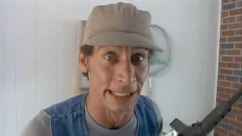 Ernest with a gun in a commercial