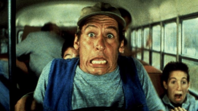Ernest sitting horrified behind the wheel of a bus in "Ernest Goes to Camp"