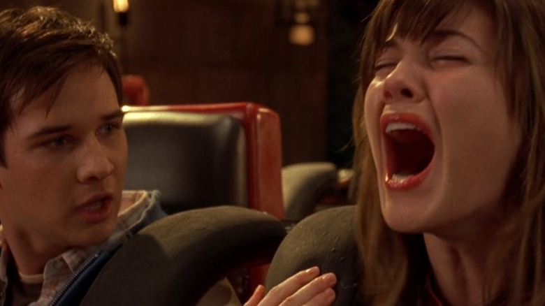 Wendy screams on a roller coaster while Kevin looks on, in "Final Destination 3" (2006)