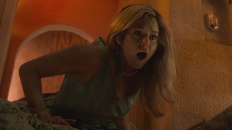 Iris watches the Sky View Tower collapse in 