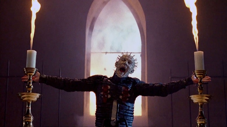 Pinhead mocks the Crucifixion in a church with arms outstretched in Hellraiser III (1992)