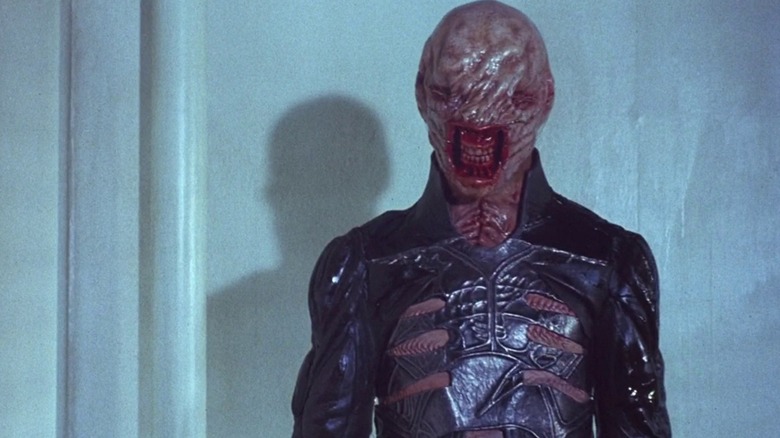 Cenobite wearing leather outfit