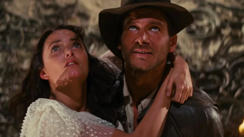 Indy holds Marion in Raiders of the Lost Ark (1981)
