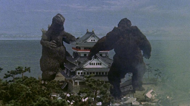 Godzilla and King Kong fighting in town in "King Kong vs. Godzilla" (1962)