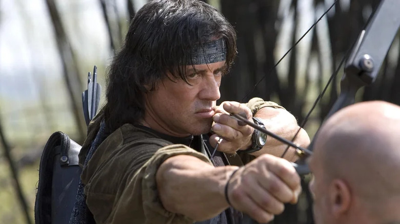 John Rambo pulls an arrow on an adversary in Rambo (2008)