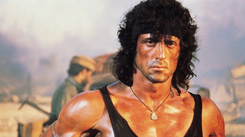 John Rambo with an Afghani soldier behind his fluffy mullet in Rambo III (1988)