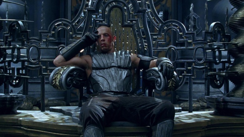 Riddick sitting on throne in Chronicles of Riddick (2004)