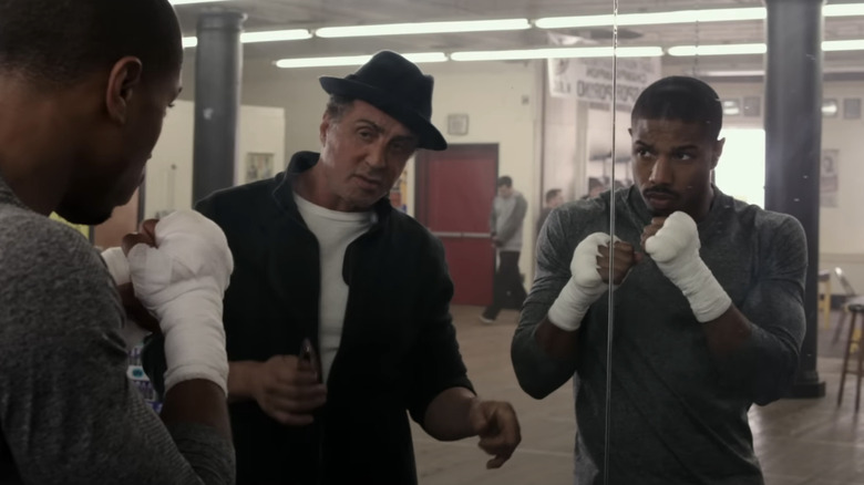 Rocky Balboa teaching Adonis Creed to box in Creed (2015)