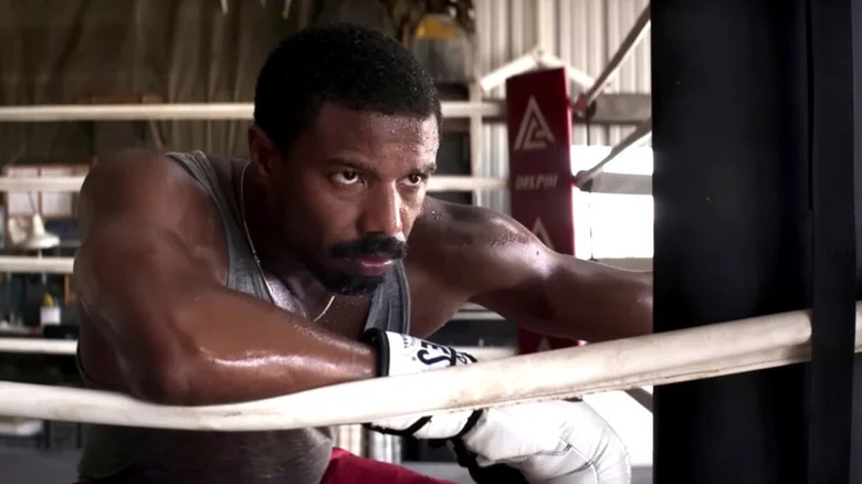 Adonis Creed leans on the ring in Creed III (2023)