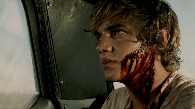 Dean bleeding, sitting in a car, in "The Texas Chainsaw Massacre: The Beginning."