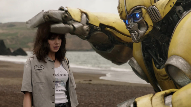 Bumblebee pats Charlie's head in "Bumblebee" (2018)