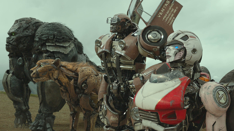 Optimus Primal, Cheetor, Wheeljack, and Arcee standing together in "Transformers: Rise of the Beasts"