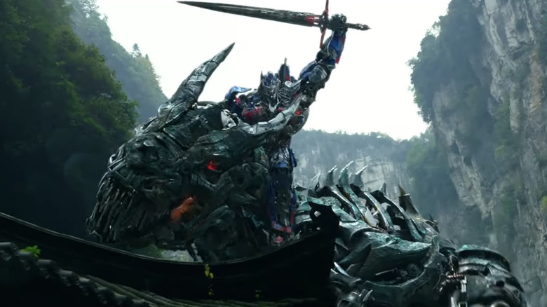 Optimus Prime rides a Dinobot in "Transformers: Age of Extinction" (2014)