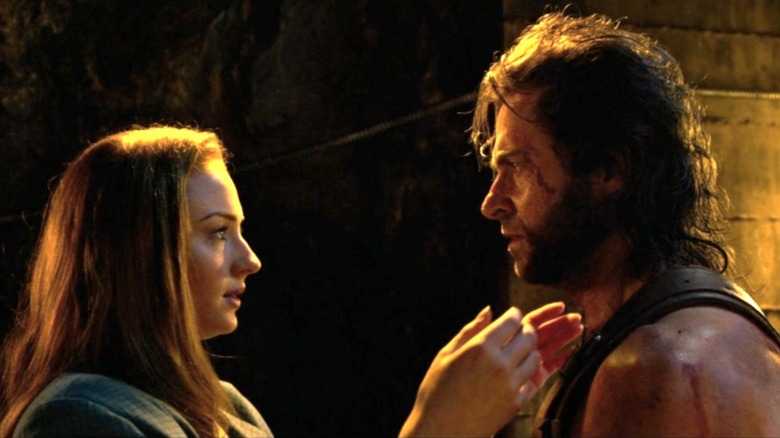 Jean Grey reaches for Weapon X's face in "X-Men: Apocalypse" (2016)