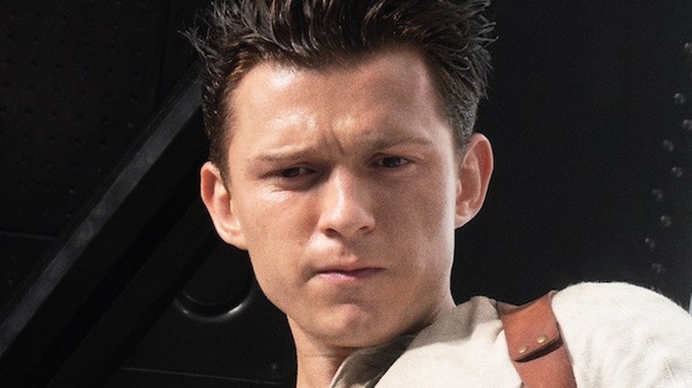 Tom Holland looking down as Sully in Uncharted