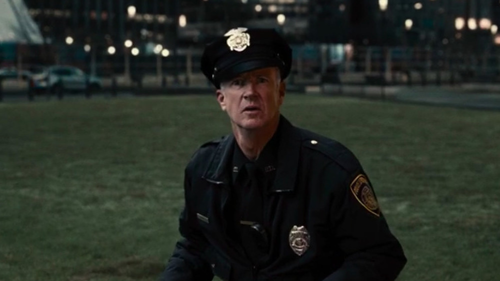 Marc McClure as a cop