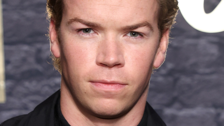 Will Poulter looking serious