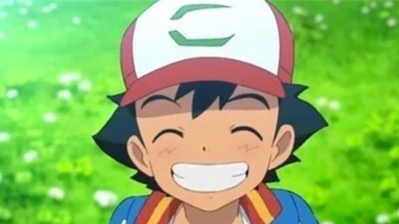 Ash smiling Pokémon
