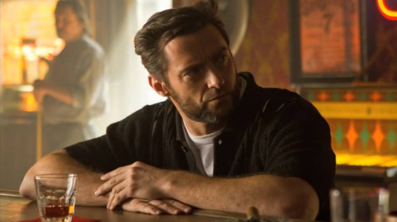 Wolverine smoking at a bar