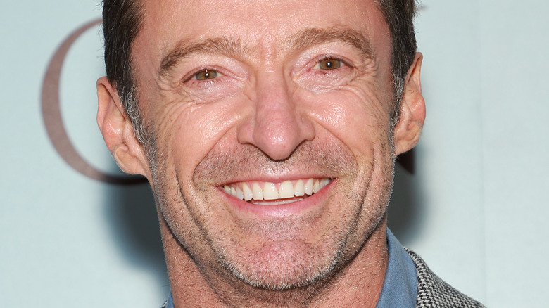 Hugh Jackman smiling at a press event for "The Son"