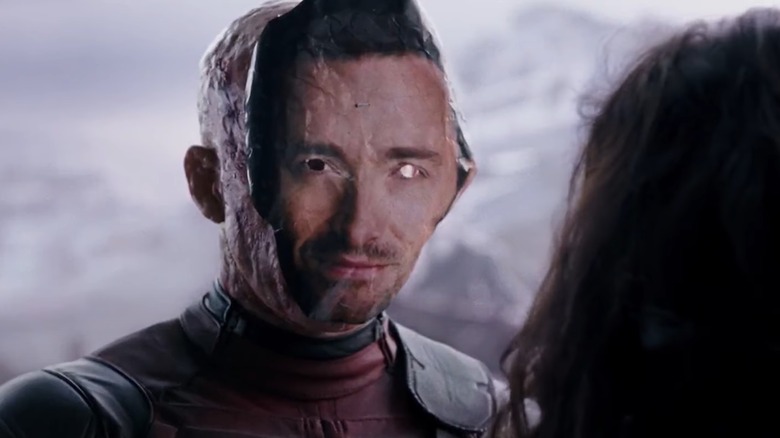 Deadpool wearing Hugh Jackman mask