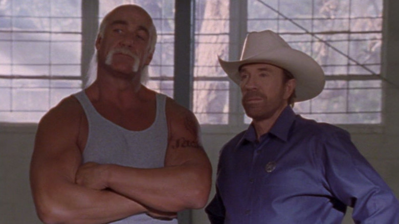 Boomer and Walker stand side by side in Walker: Texas Ranger