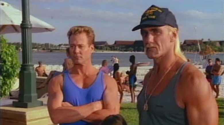 Spencer and Brubaker stand on the beach in Thunder in Paradise.