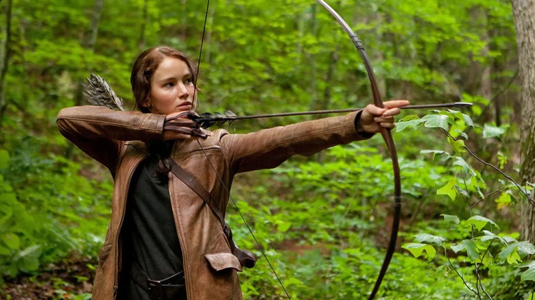 Katniss firing an arrow in The Hunger Games
