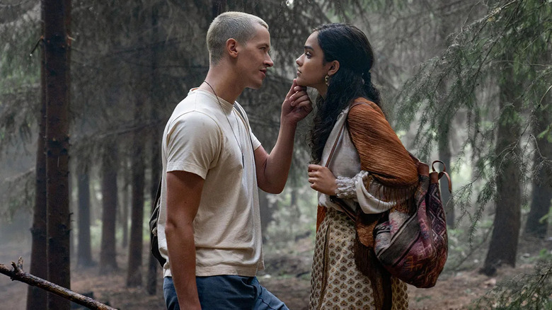 Corio and Lucy Gray in the woods about to kiss in The Hunger Games: The Ballad of Songbirds & Snakes