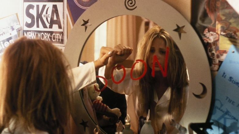 Helen looking at the mirror message