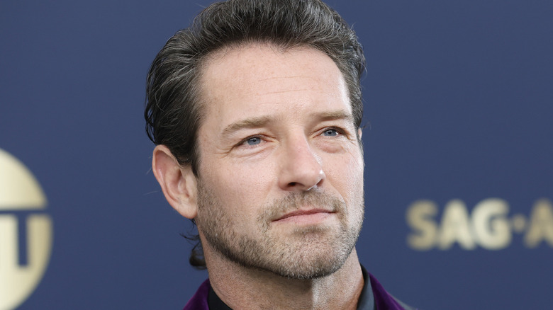 Ian Bohen in floral suit on red carpet