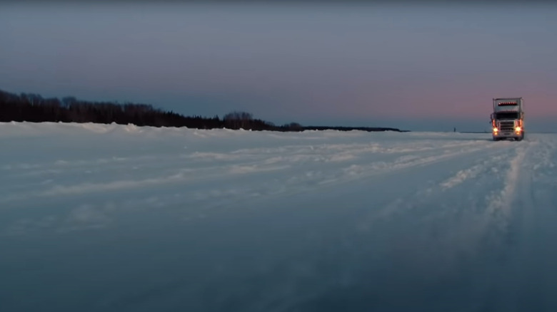 Alex drives across an ice lake in Ice Rock Truckers