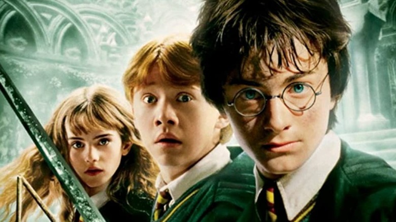 Hermione, Ron, and Harry standing heroically